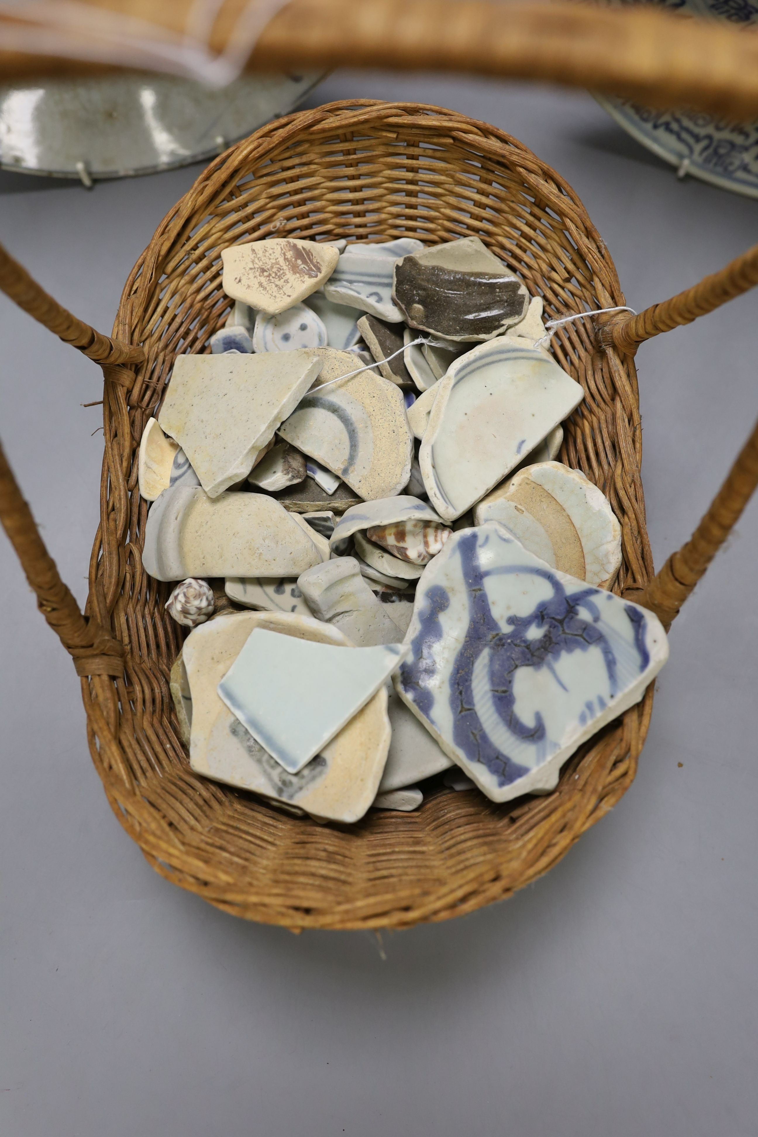 Six 19th century blue and white Chinese dishes, together with a basket of assorted fragments